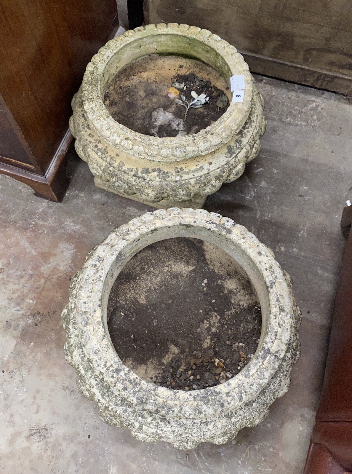 A pair of reconstituted stone circular garden planters, diameter 46cm, height 34cm